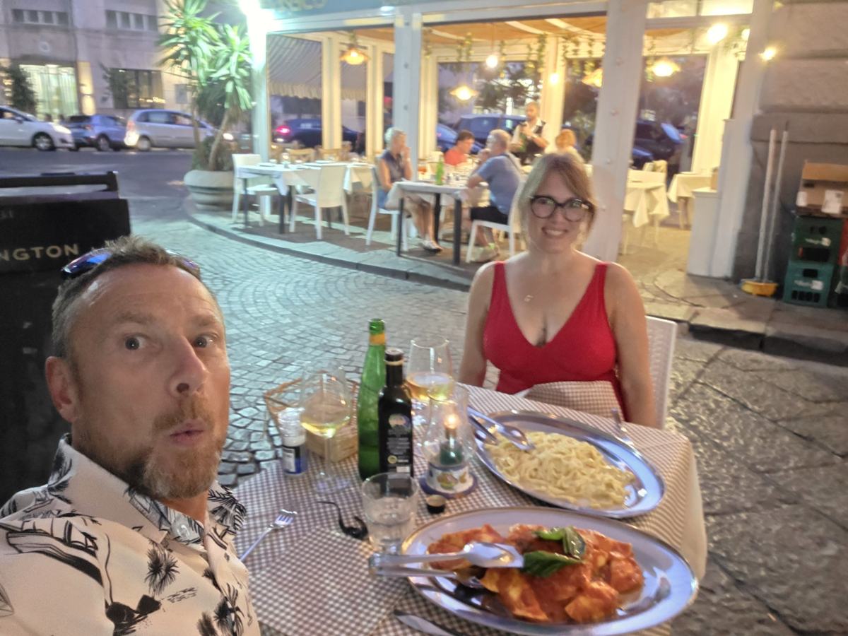 The Naples chapter ends at the table, with pasta and wine.