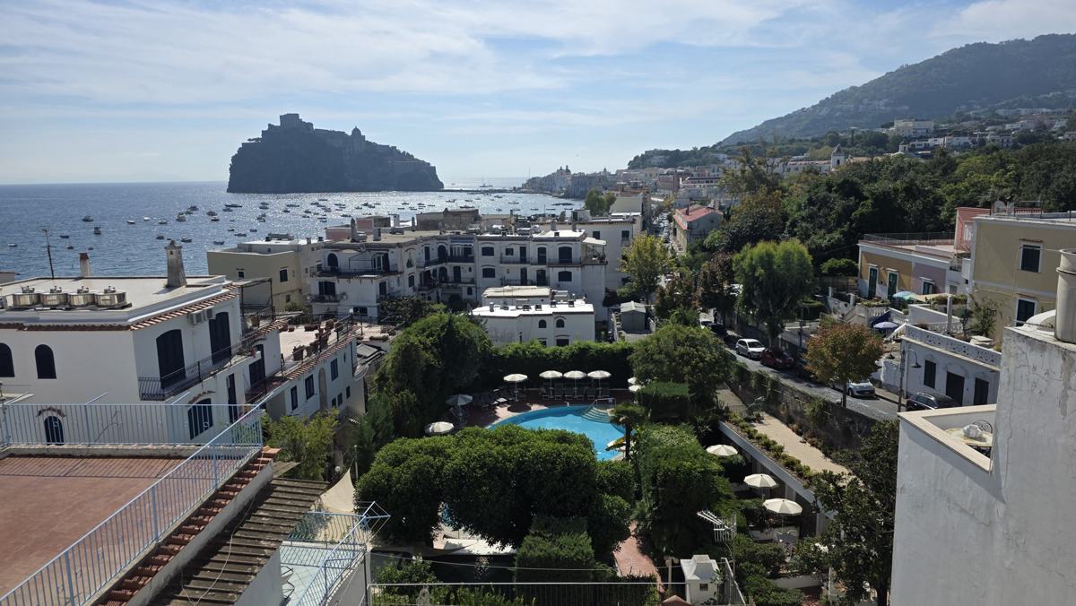 Ischia rooftops, gardens and the castle beyond.