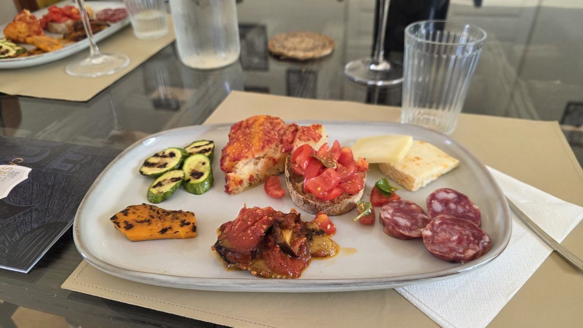 Vegetables, tomato-topped bread, cheese and salami at Casa D’Ambra, our favourite wine-and-food experience.