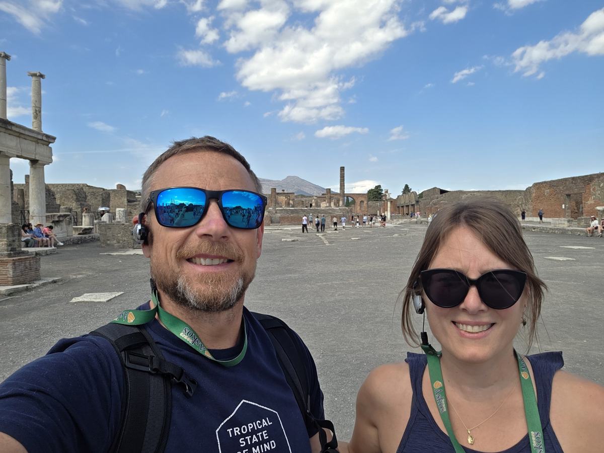 Together in Pompeii, with Vesuvius beyond the ruins.