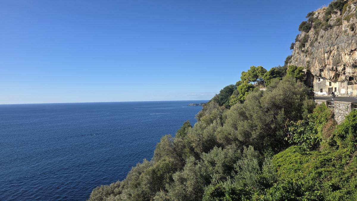 The coastal road winding above the water.