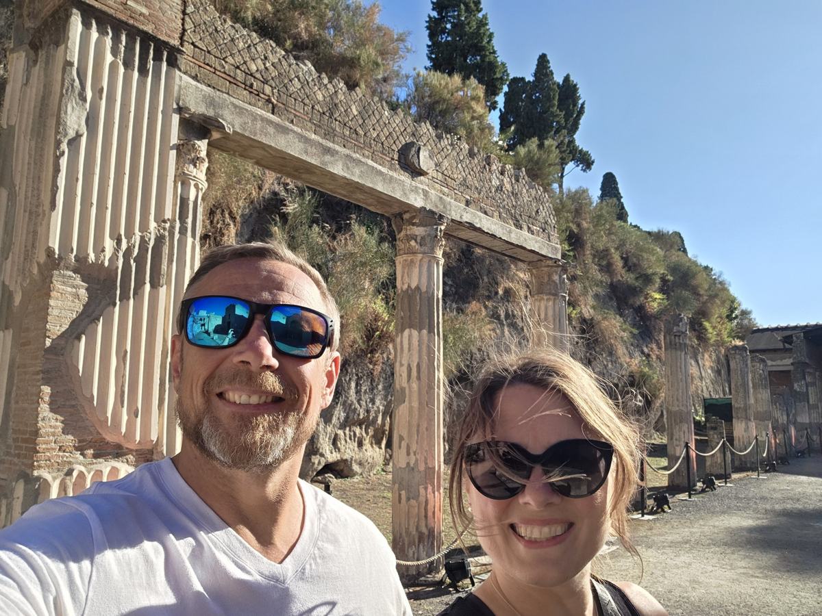Exploring the preserved streets and columns at Herculaneum.