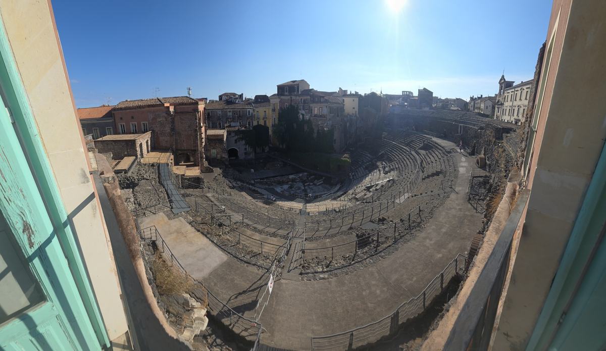 The ancient theatre framed by the surrounding city.
