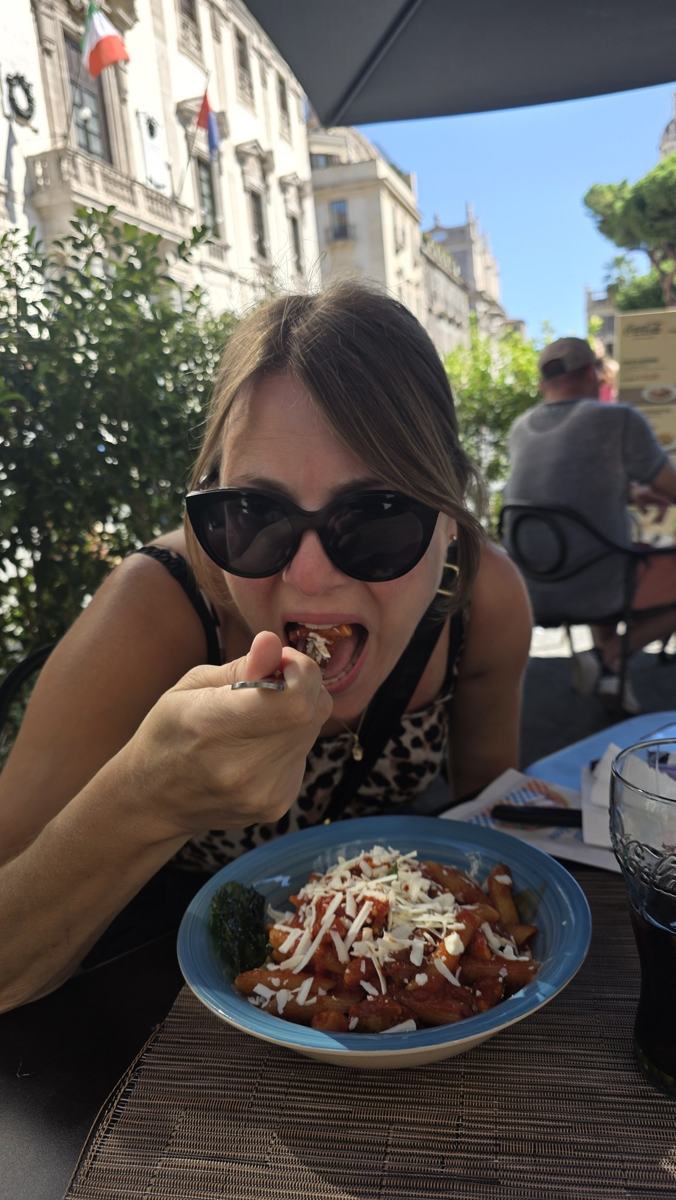 Jenn enjoying a pasta stop in Catania.