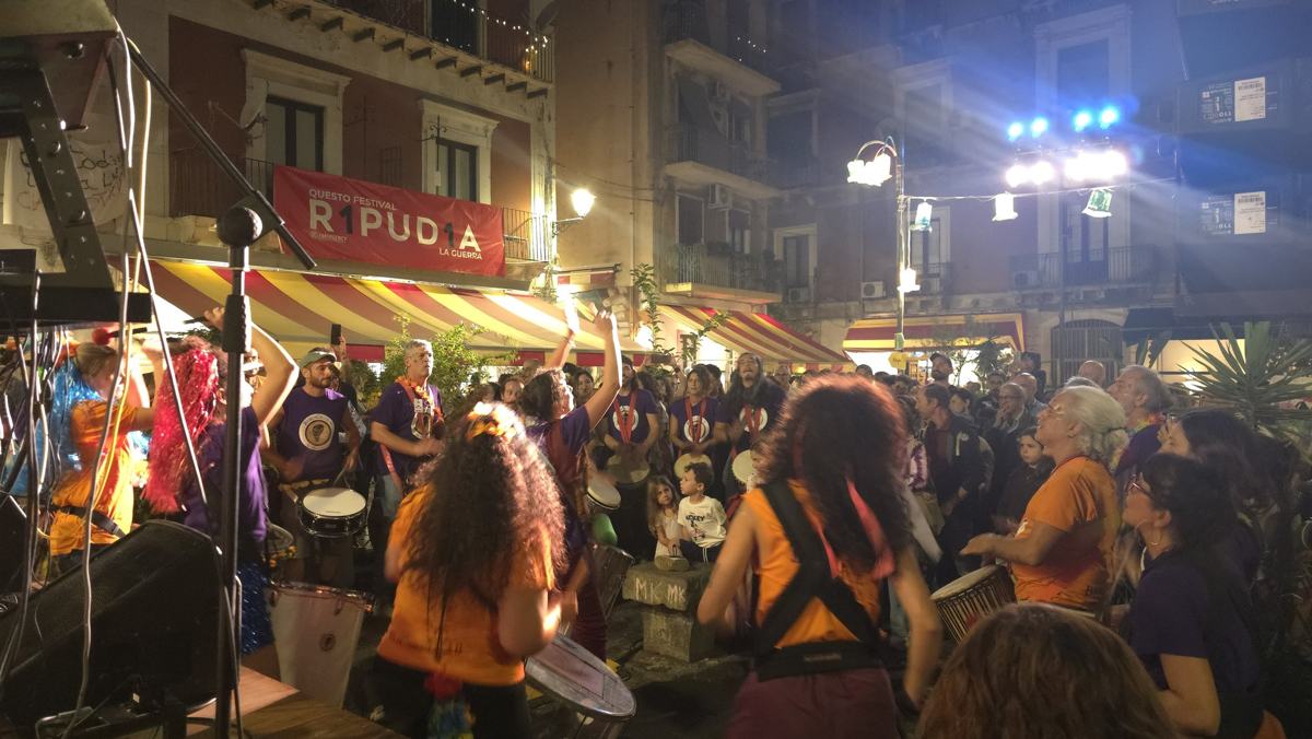 The evening crowd gathering around the music.