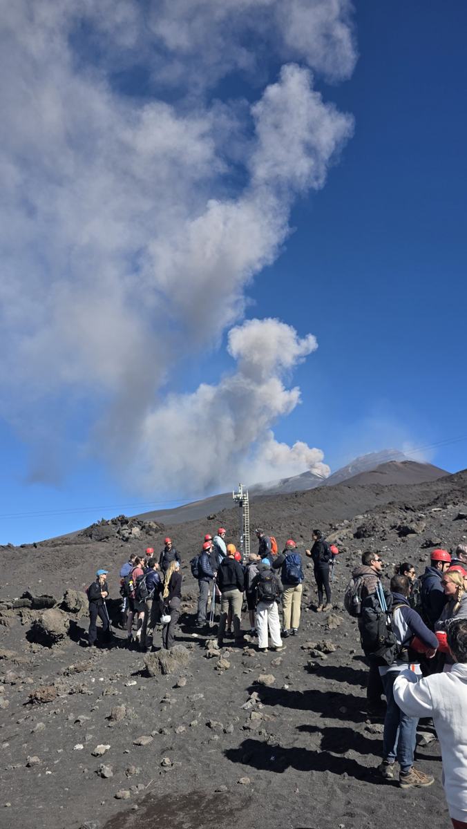 Visitors give a sense of scale to the volcanic landscape.