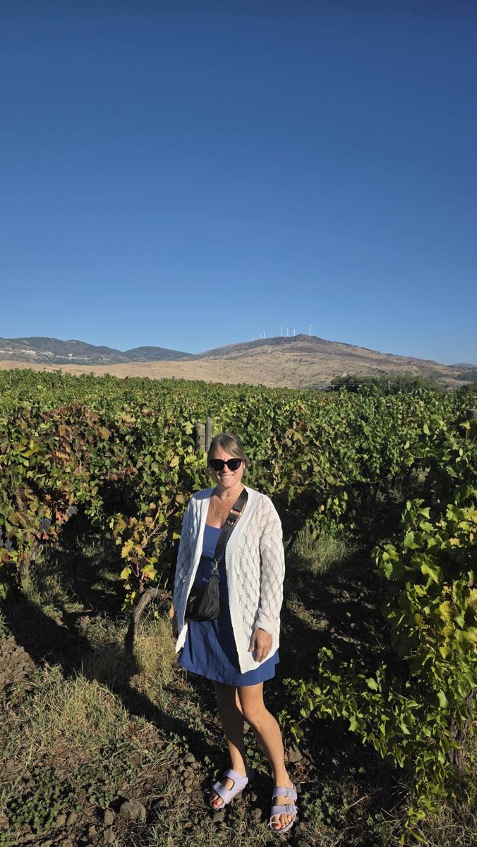 Jenn among the vines.
