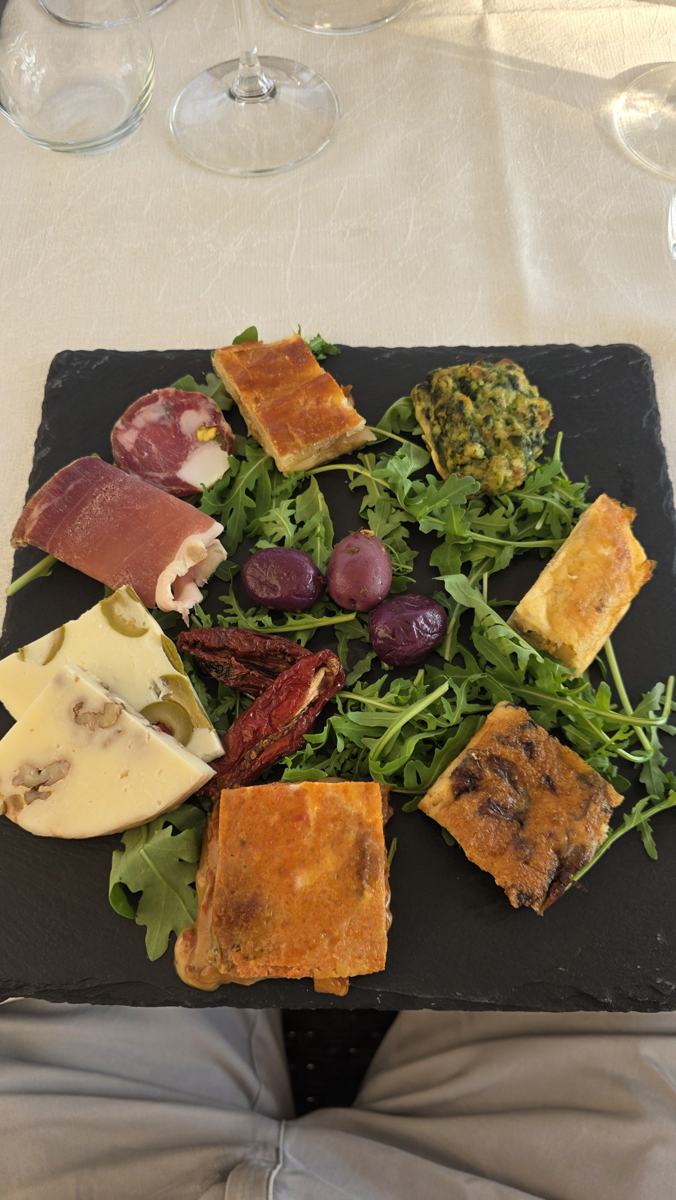 Cheese, cured meats, olives and savoury bites alongside the tasting.