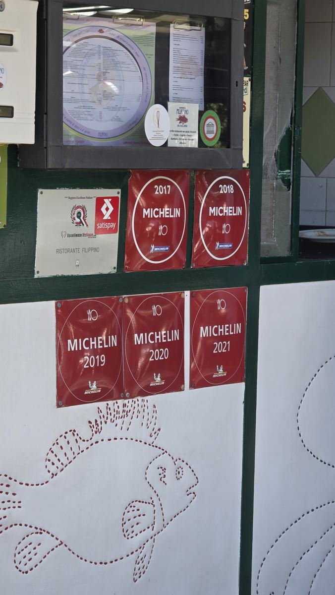 Michelin plaques dated 2017–2021 displayed at Filippino; these do not establish a Michelin star.