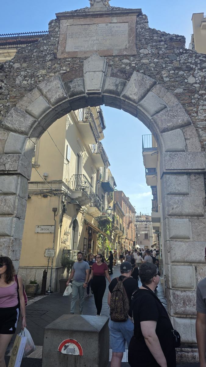 Entering Taormina through its old gateway.
