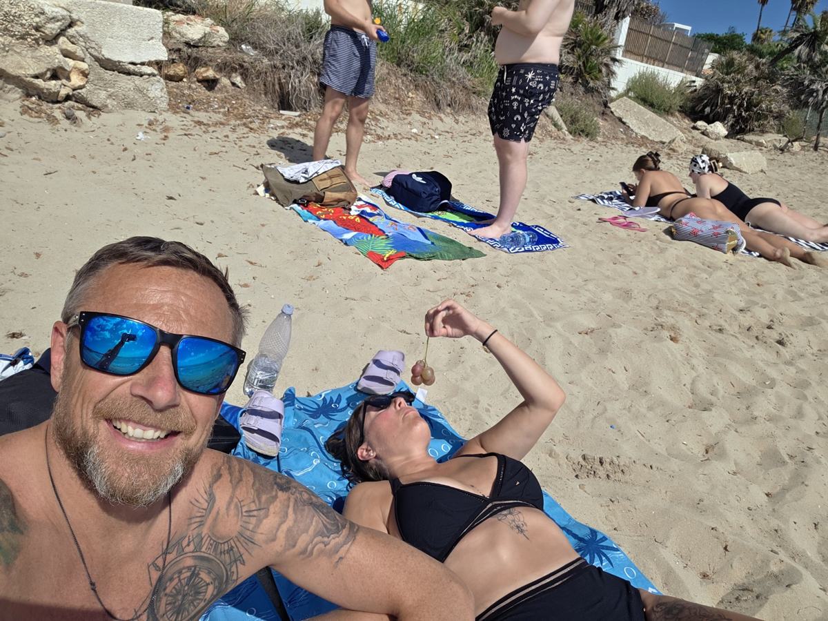 A pause on the sand after sightseeing.