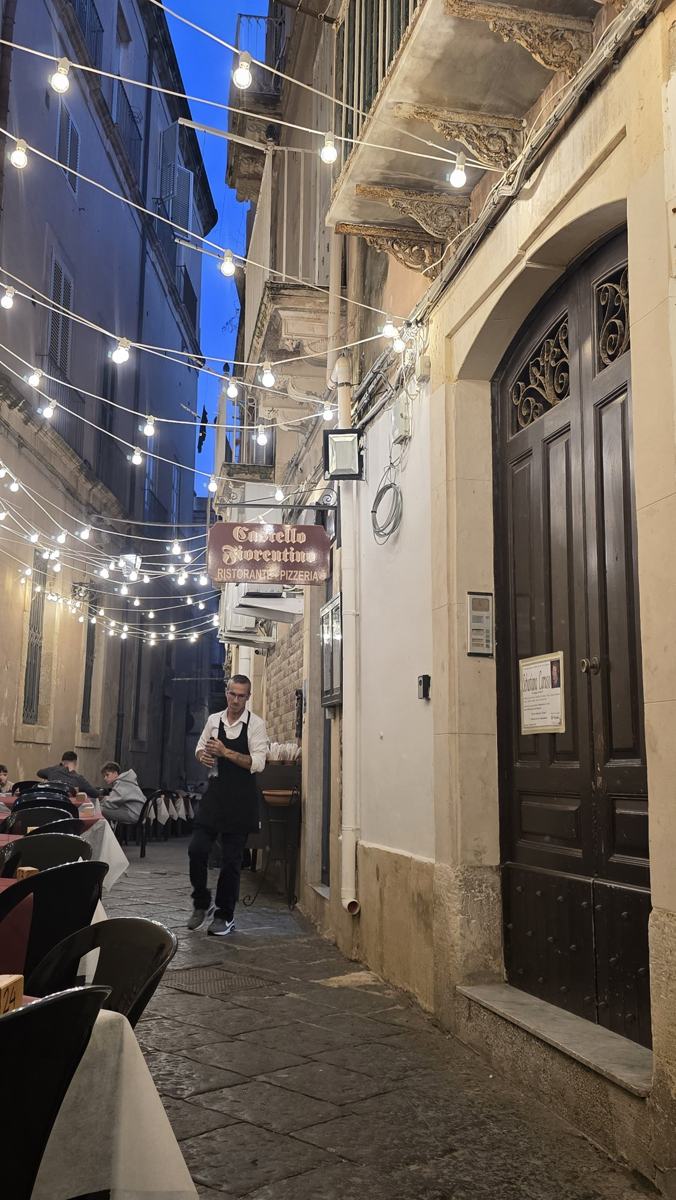 An Ortigia lane strung with lights on our last evening.