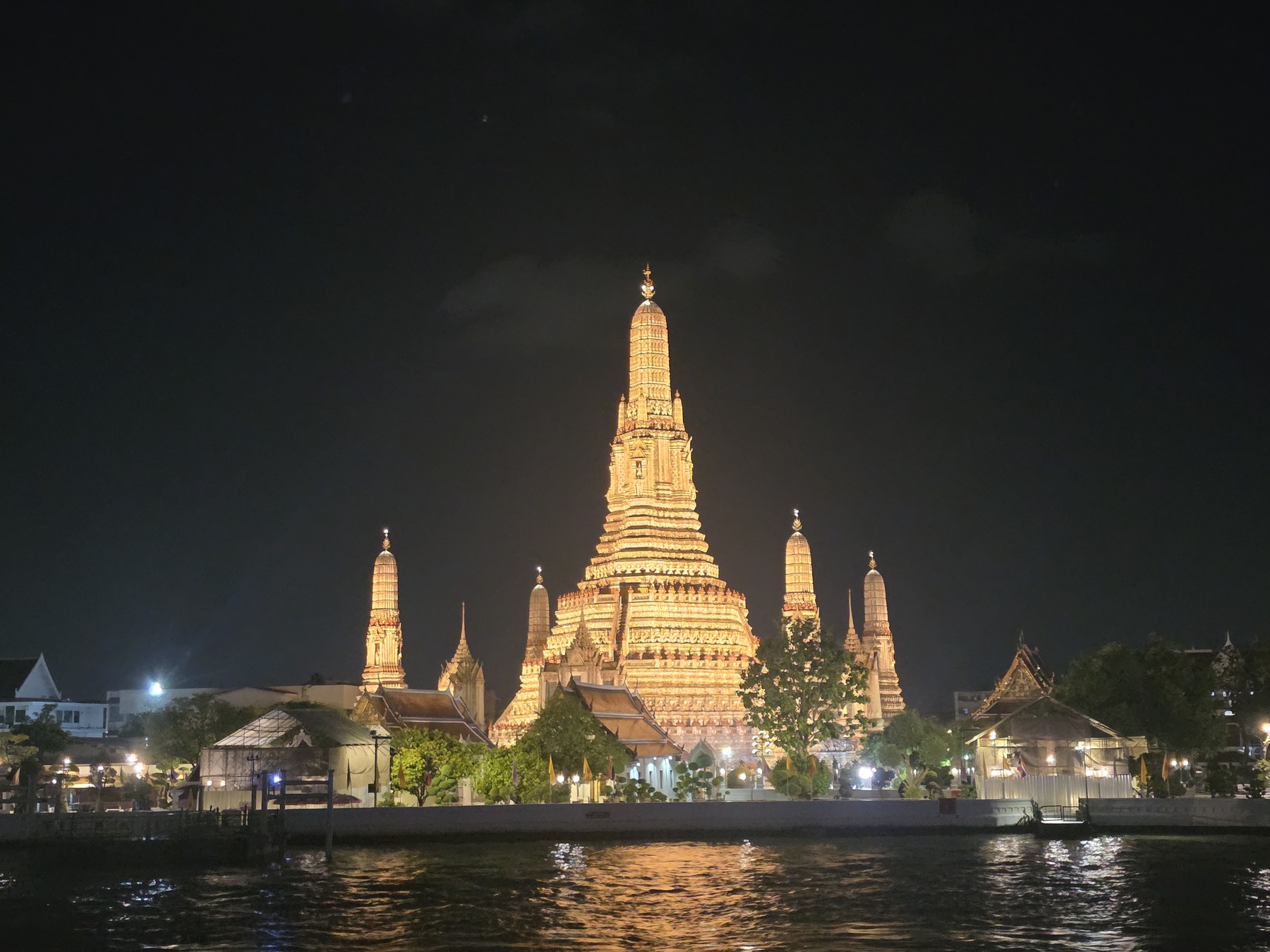 Wat Arun illuminated across the Chao Phraya