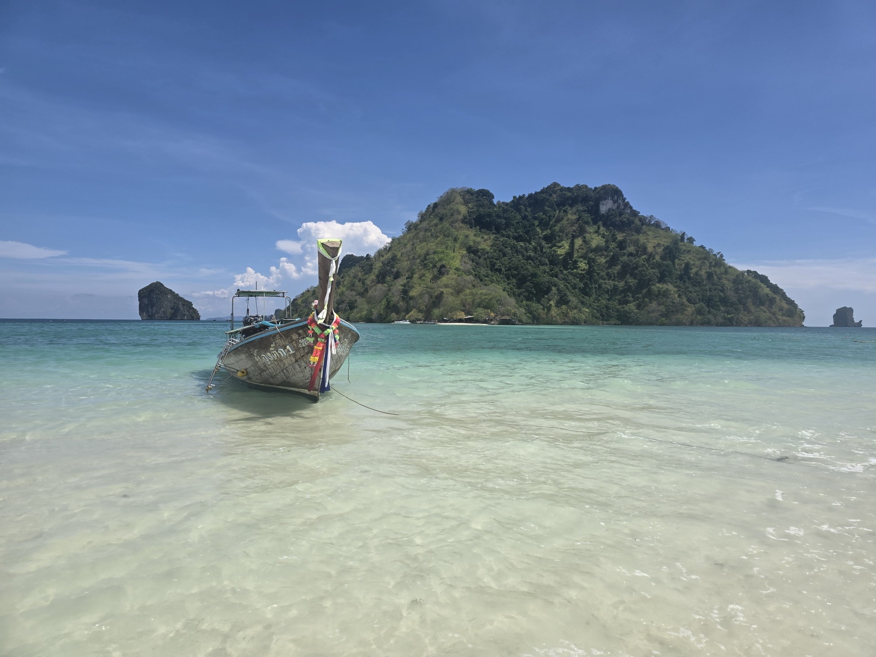 Longtail boat among Krabi's limestone islands